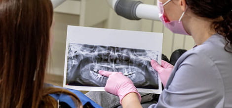Dentist explaining X-ray to patient